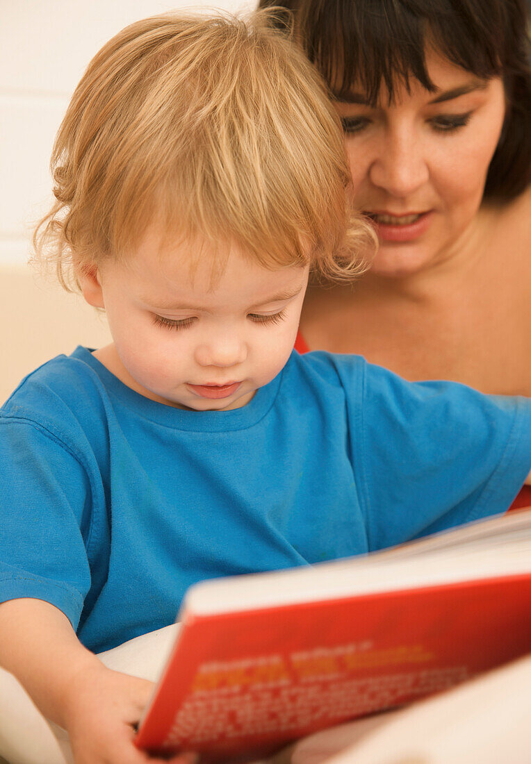 Woman with a child reading a bedtime story