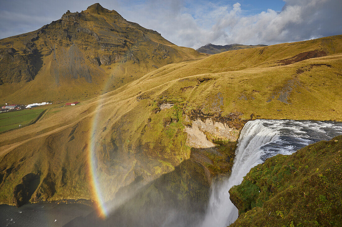 Skogafoss Falls in Southern Iceland with a rainbow in the mist; Iceland