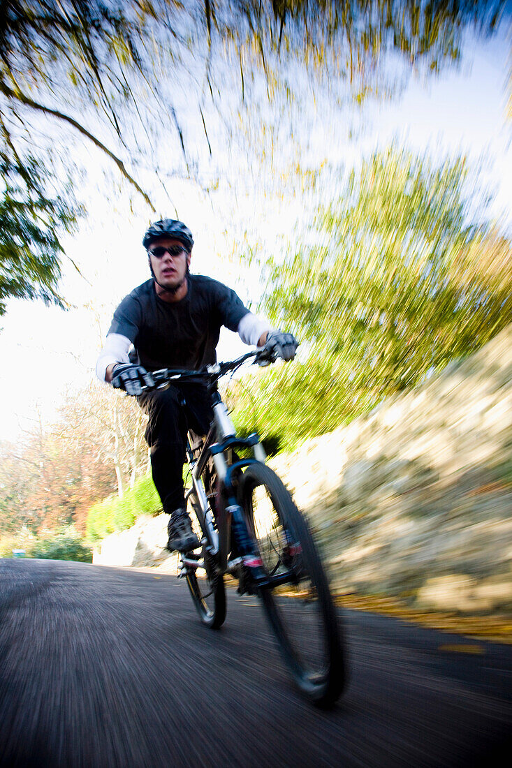 Man cycling on a country road