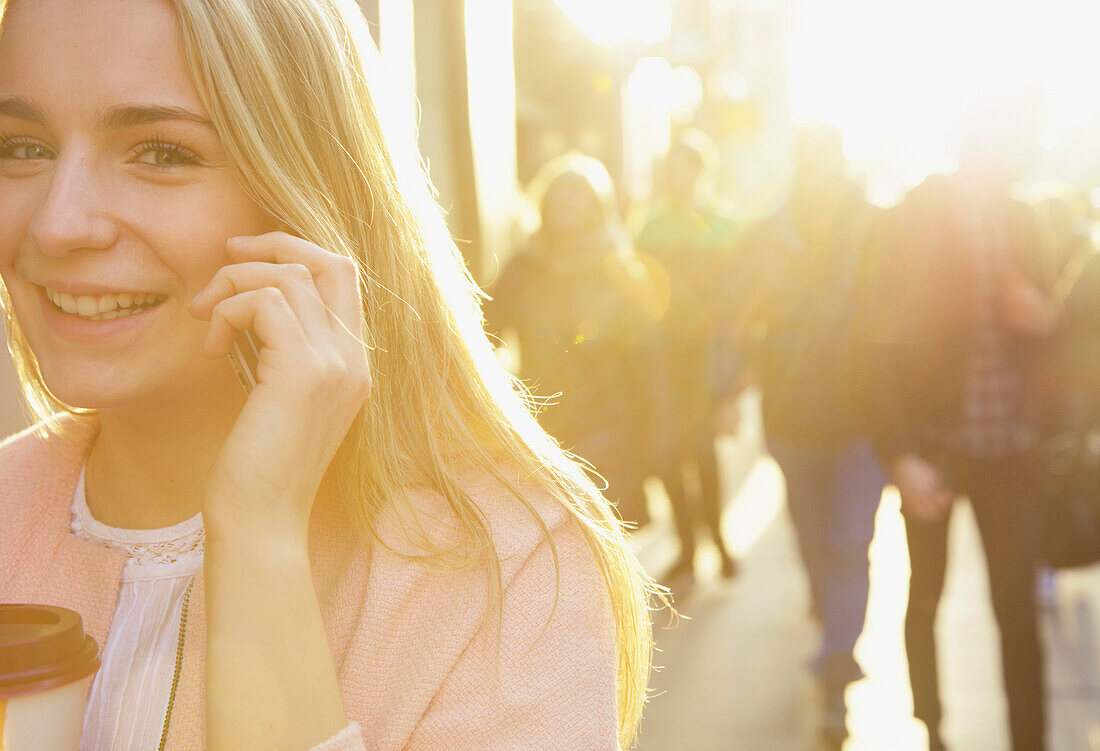 Woman Talking on Cell phone on City Street