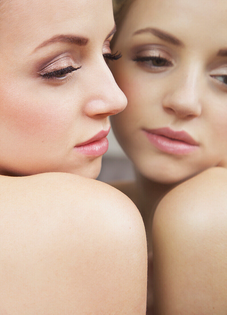 Close up of Woman Face and Mirror Image