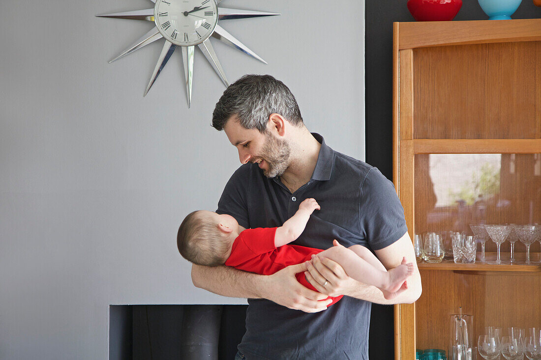 Father Holding Baby Girl