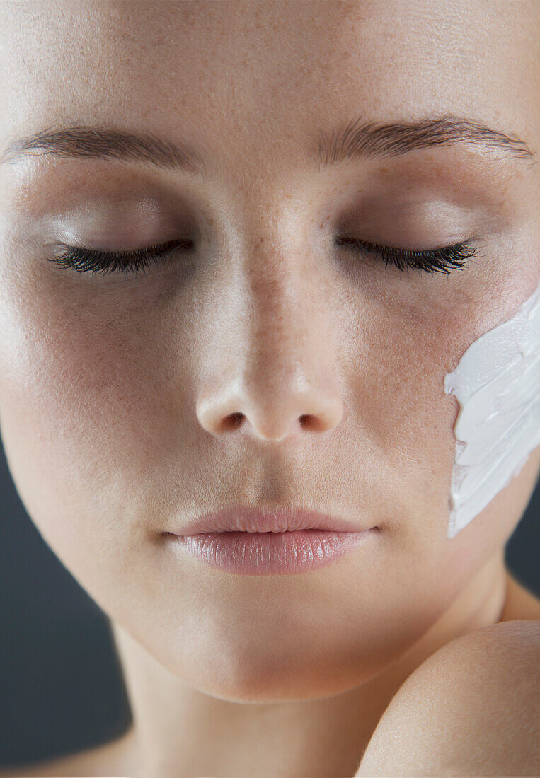 Woman with Beauty Cream on Face, Close-up