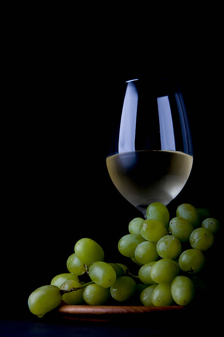 Glass of White Wine and Grapes