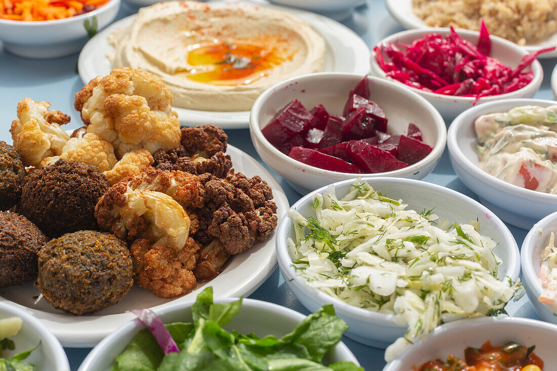 Still life falafel, hummus and Israeli cuisine side dishes