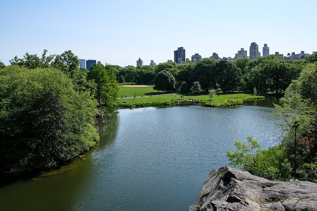 Turtle Pond, a two-acre water body at the bse of Belvedere Castle, popular for relaxing and picnicing in Central Park, Manhattan Island, New York City, United States of America, North America