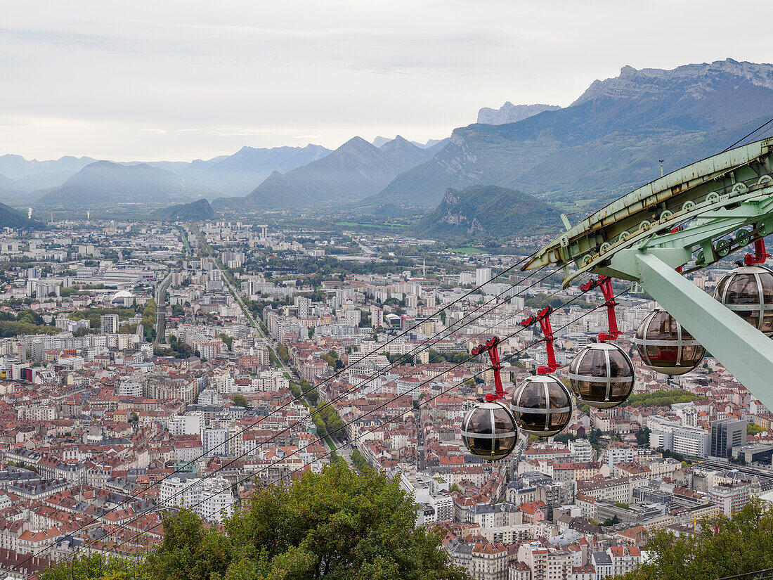 View from the Bastille hill over Grenoble with mountains in the background and cable car in the foreground, Grenoble, Auvergne-Rhone-Alpes, France, Europe