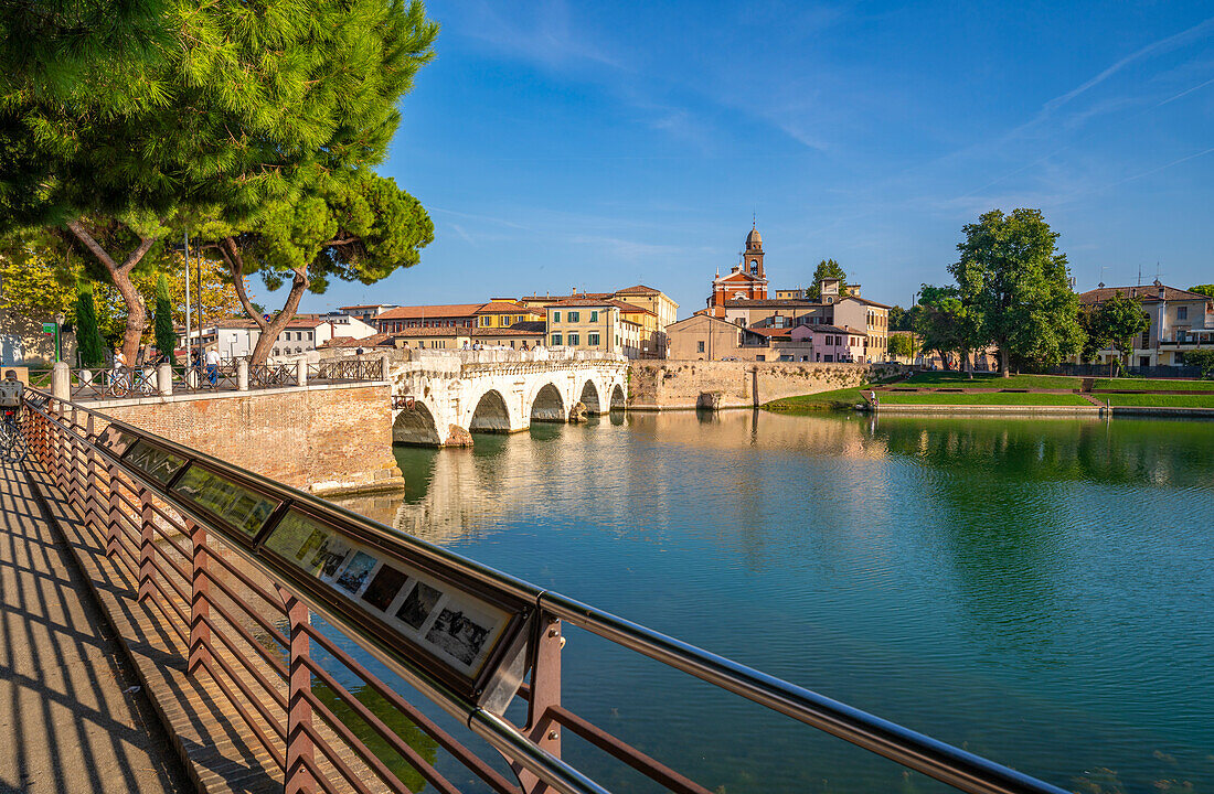 View of Ponte di Tiberio reflecting in Rimini Canal from Borgo San Giuliano, Rimini, Emilia-Romagna, Italy, Europe
