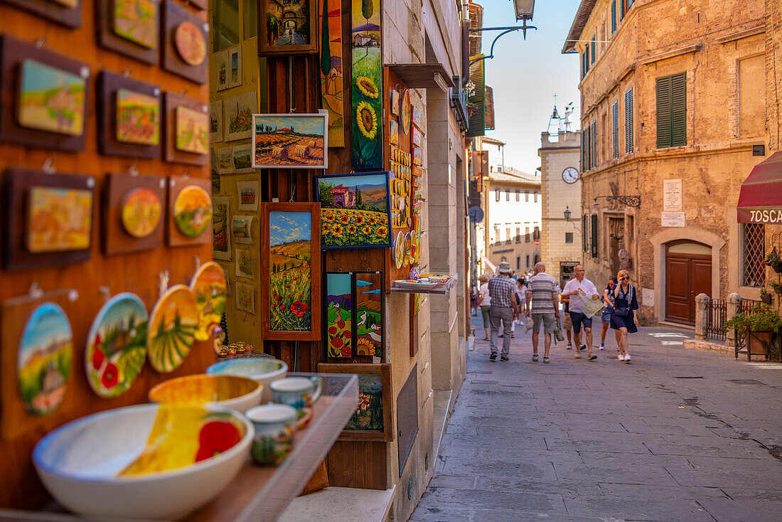View of shops and shoppers in narrow street in Montepulciano, Montepulciano, Province of Siena, Tuscany, Italy, Europe