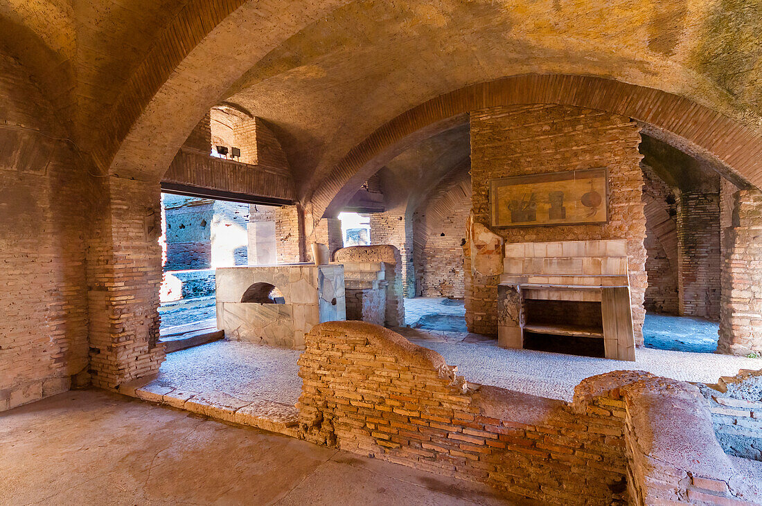 Thermopolium (Roman bar for hot food and drink), Ostia Antica archaeological site, Ostia, Rome province, Latium (Lazio), Italy, Europe