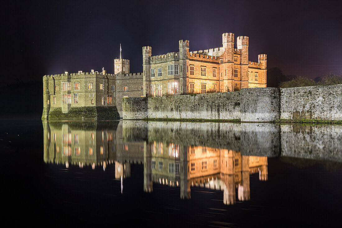 Leeds Castle at night, illuminated, reflected in moat, near Maidstone, Kent, England, United Kingdom, Europe