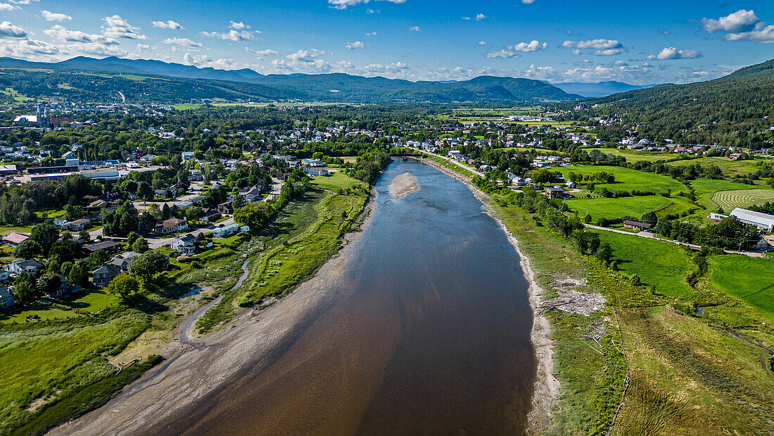 Aerial of the Gouffre River flowing in the St. Lawrence River, Quebec, Canada, North America