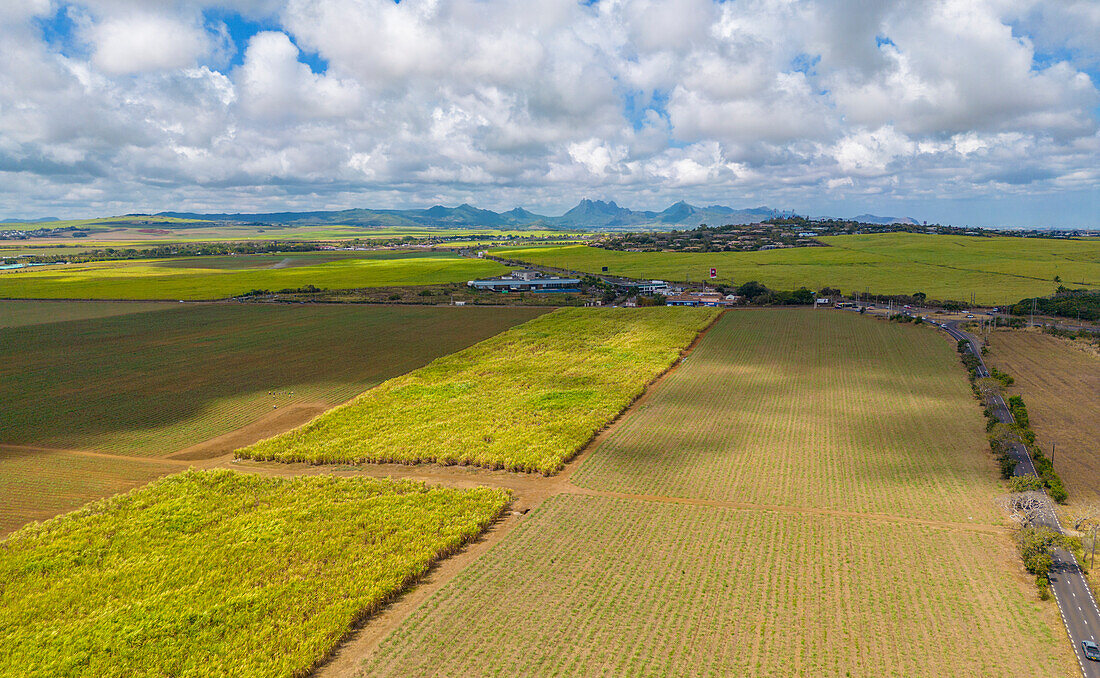 Aerial view of patchwork fields and mountains visible on horizon near Mapou, Rempart District, Mauritius, Indian Ocean, Africa