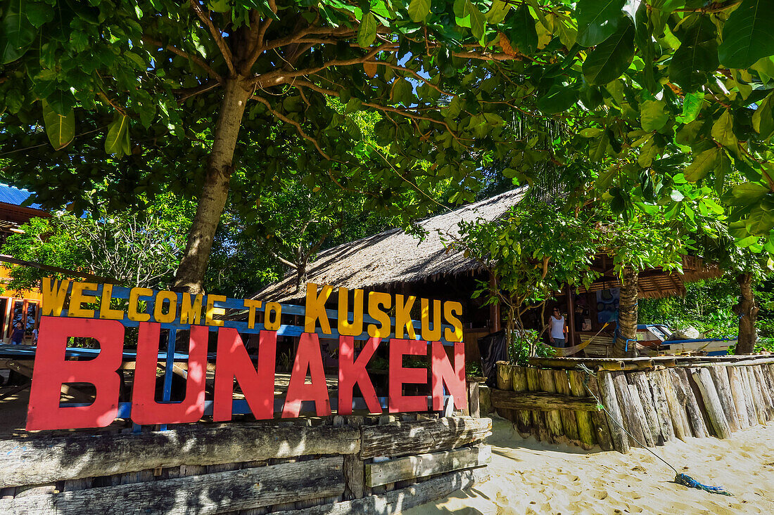 Beach entrance to a resort on the east coast of this coral fringed holiday and diving island, Bunaken Island, North Sulawesi, Indonesia, Southeast Asia, Asia