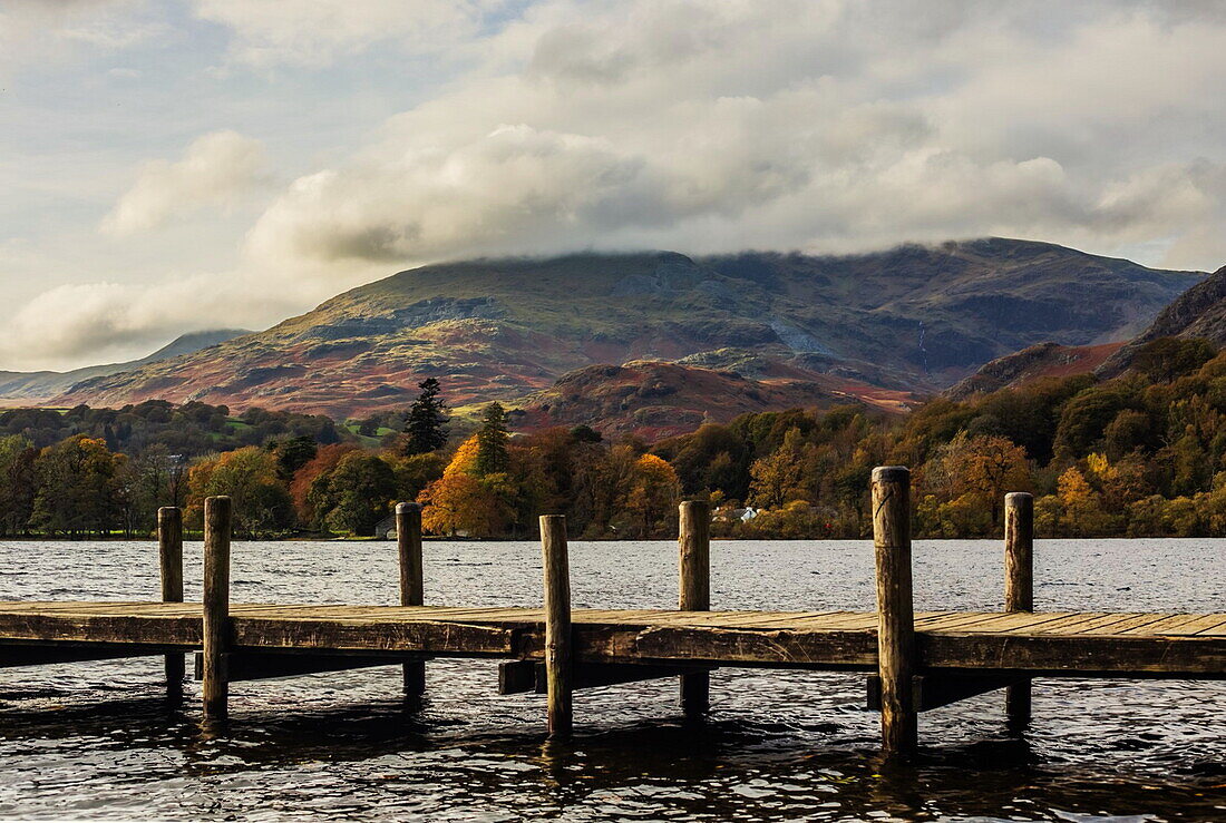 View across Coniston Water in autumn towards Coniston Old Man, Lake District National Park, UNESCO World Heritage Site, Cumbria, England, United Kingdom, Europe