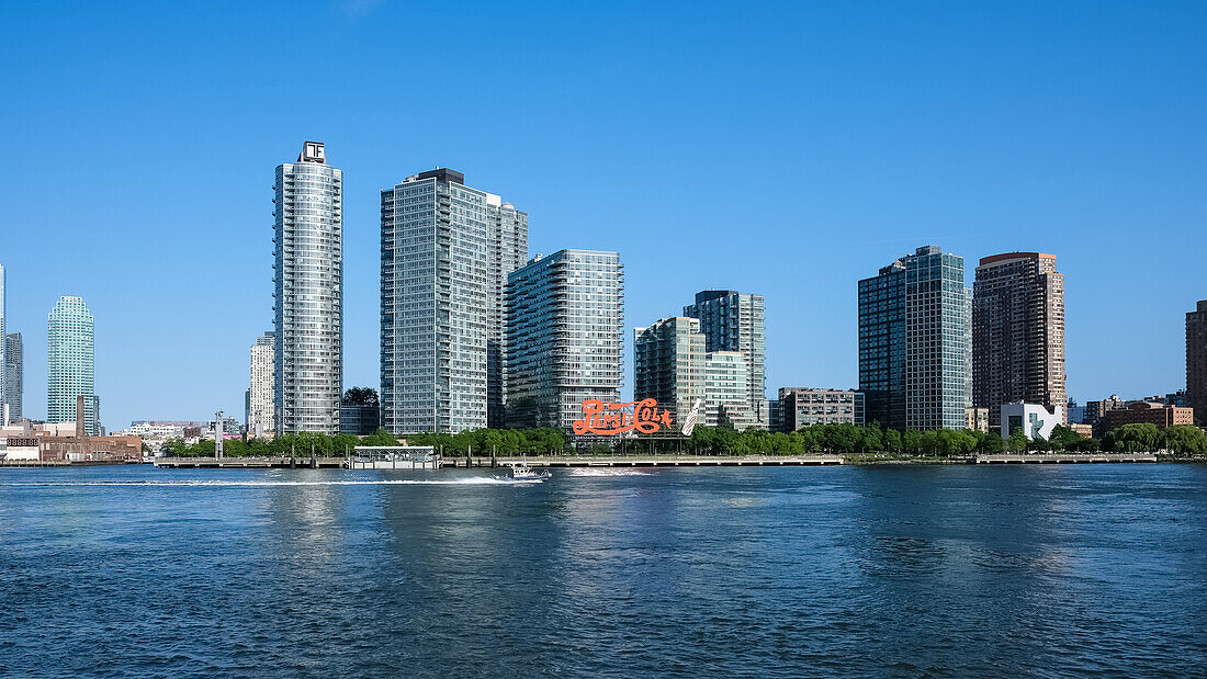 The Pepsi-Cola sign, built in 1940, a neon sign at Gantry Plaza State Park in the Long Island City neighborhood of Queens, visible fromManhattan the East East River, New York City, United States of America, North America