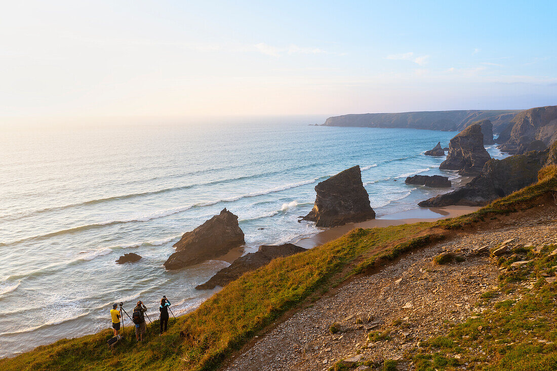 Aerial view at sunset of photographers at Carnewas and Bedruthan Steps, Bedruthan Steps, Newquay, Cornwall, England, United Kingdom, Europe