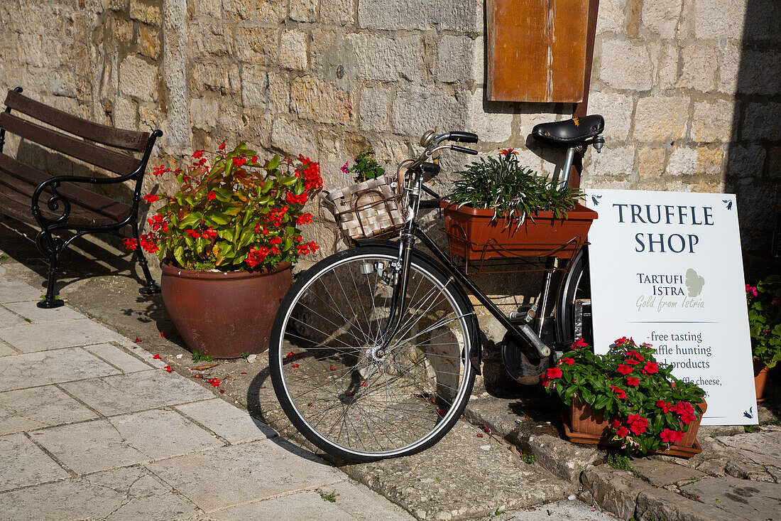 Bicycle in Front of Gift Shop, Motovun, Croatia, Europe