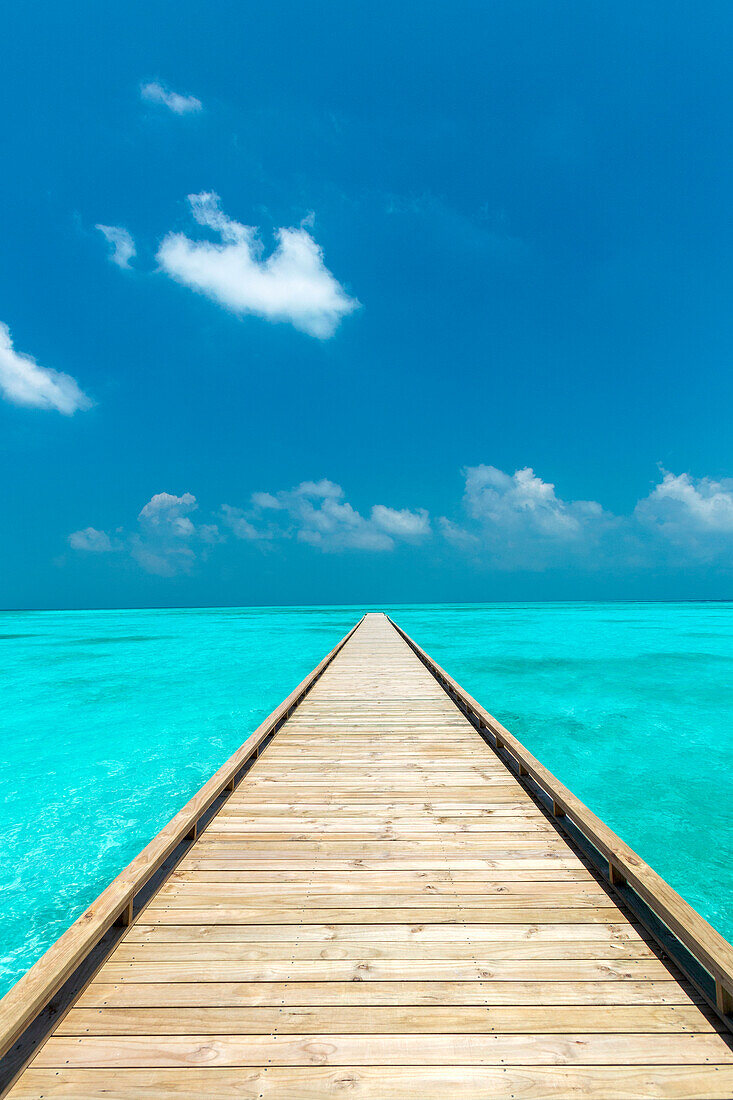 Wooden Jetty out to tropical Sea, The Maldives, Indian Ocean, Asia