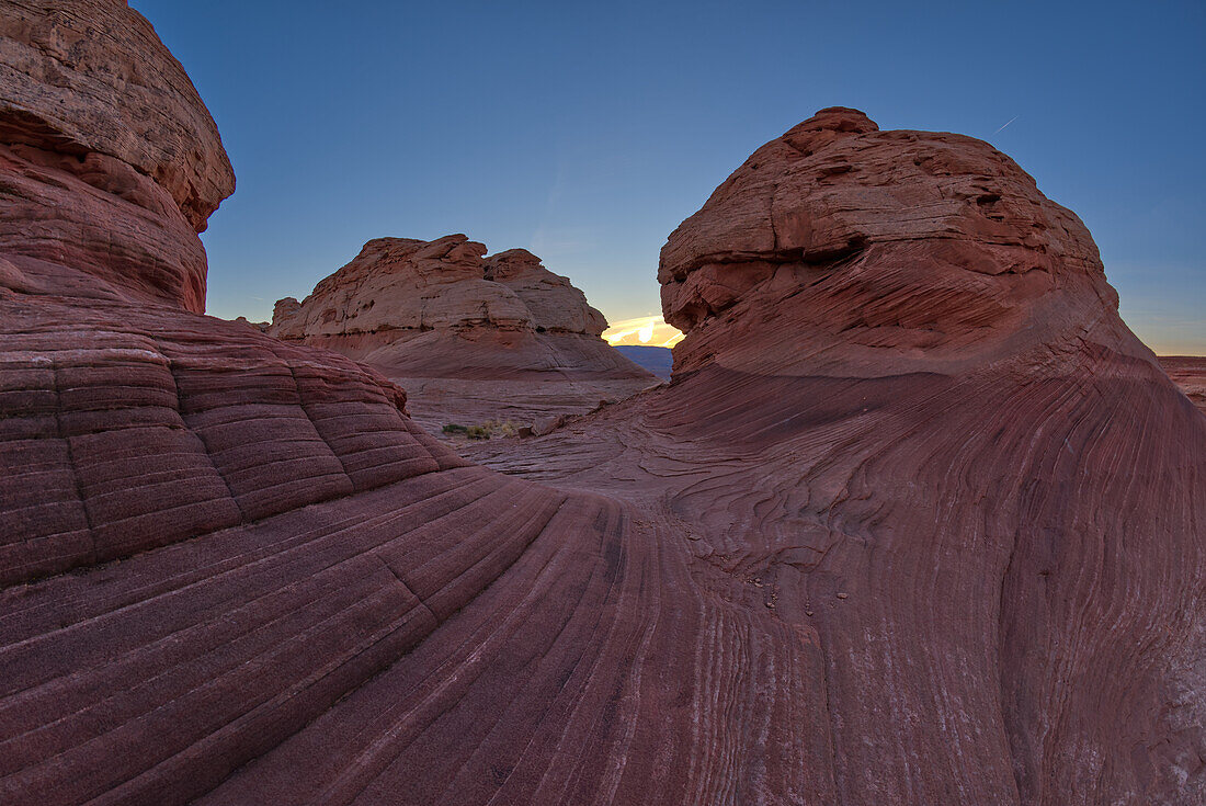 The west rock ridge of the New Wave along the Beehive Trail at sundown, Glen Canyon Recreation Area, near Page, Arizona, United States of America, North America