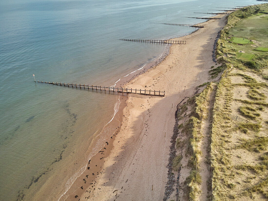 Aerial view of beach and dunes at Dawlish Warren, guarding the mouth of the River Exe, looking south along the coast towards the town of Dawlish, Devon, England, United Kingdom, Europe