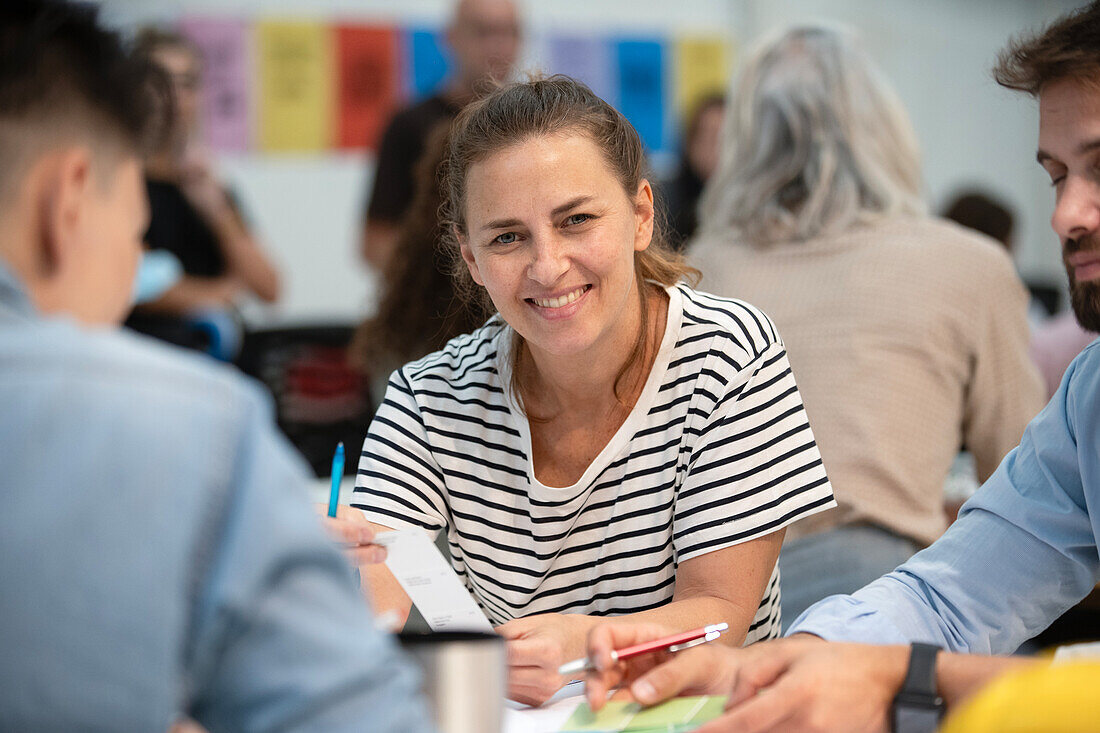 Female architect looking at the camera during meeting