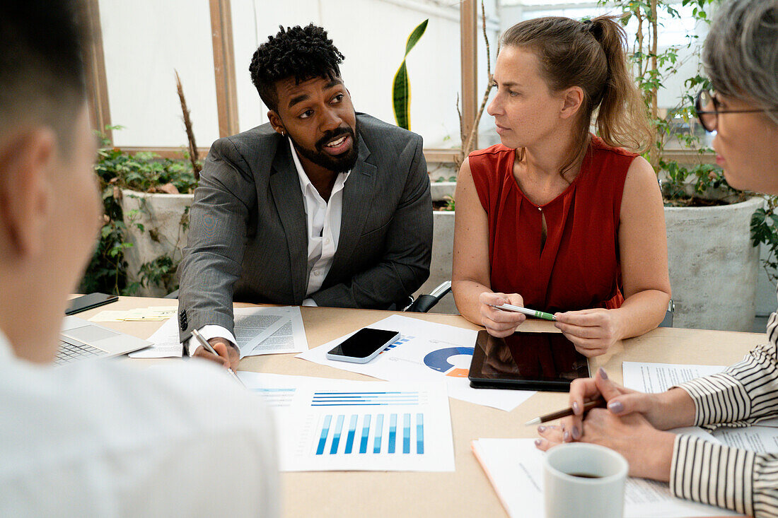 Businessman discussing with colleagues about stadistics