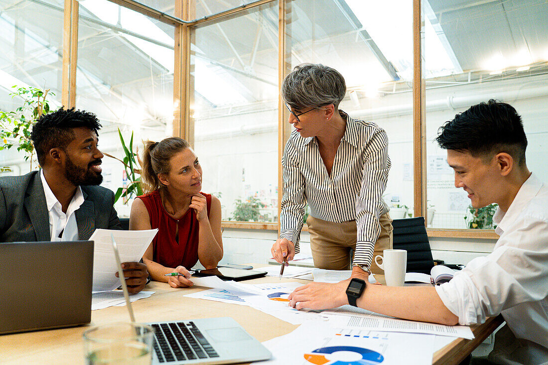 Female manager having a meeting with employees