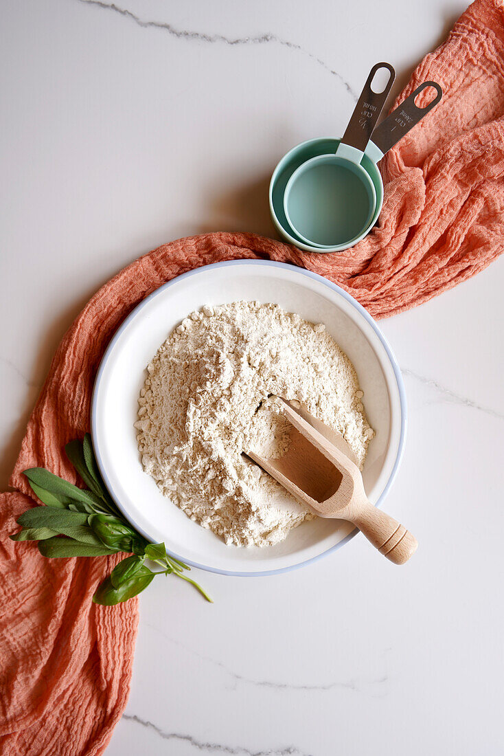 Buckwheat flour ingredient cooking and baking concept on white marble background. Top down flatlay