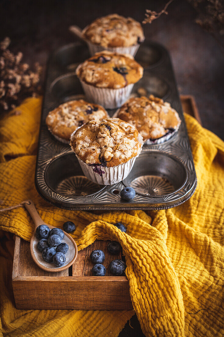 Pumpkin and blueberries muffins in a baking tray