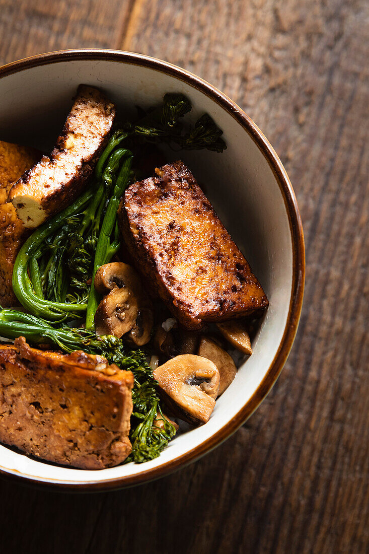 Soy tofu with tenderstem broccoli, mushrooms and rice.