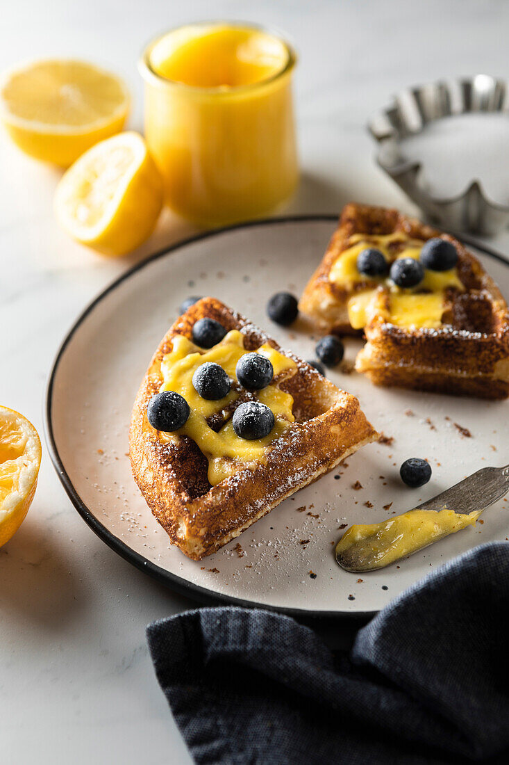 Waffles with lemon curd and blueberries