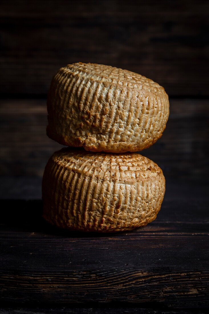 Smoked cheese on dark background with blanks