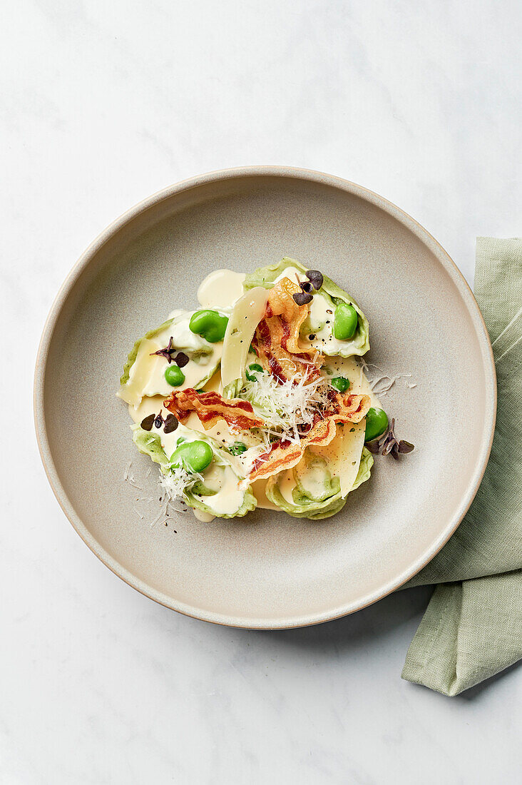 Tortelloni, cream sauce, pancetta, broad beans, pecorino, basil