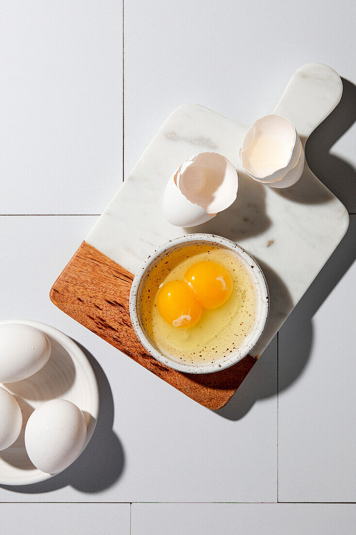 Egg with double yolk whipped in a small bowl