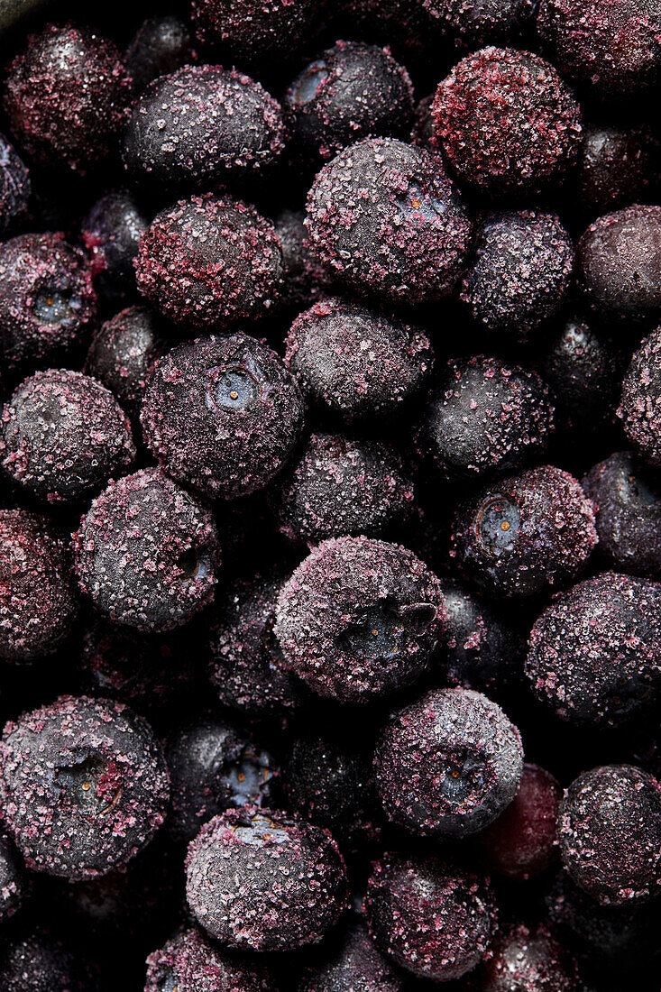 A pile of frozen blueberries