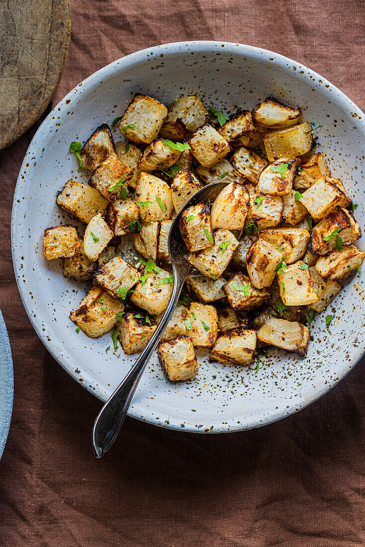 Seasoned and roasted turnips in a bowl