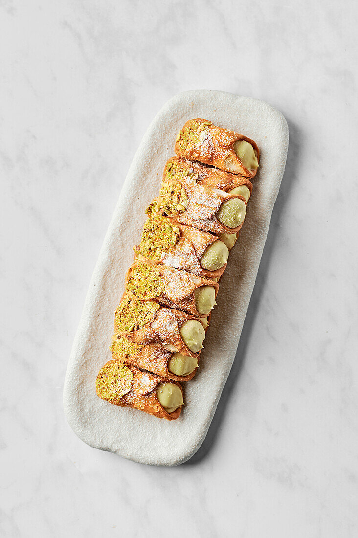 Cannoli with salted pistachio cream and roasted pistachios