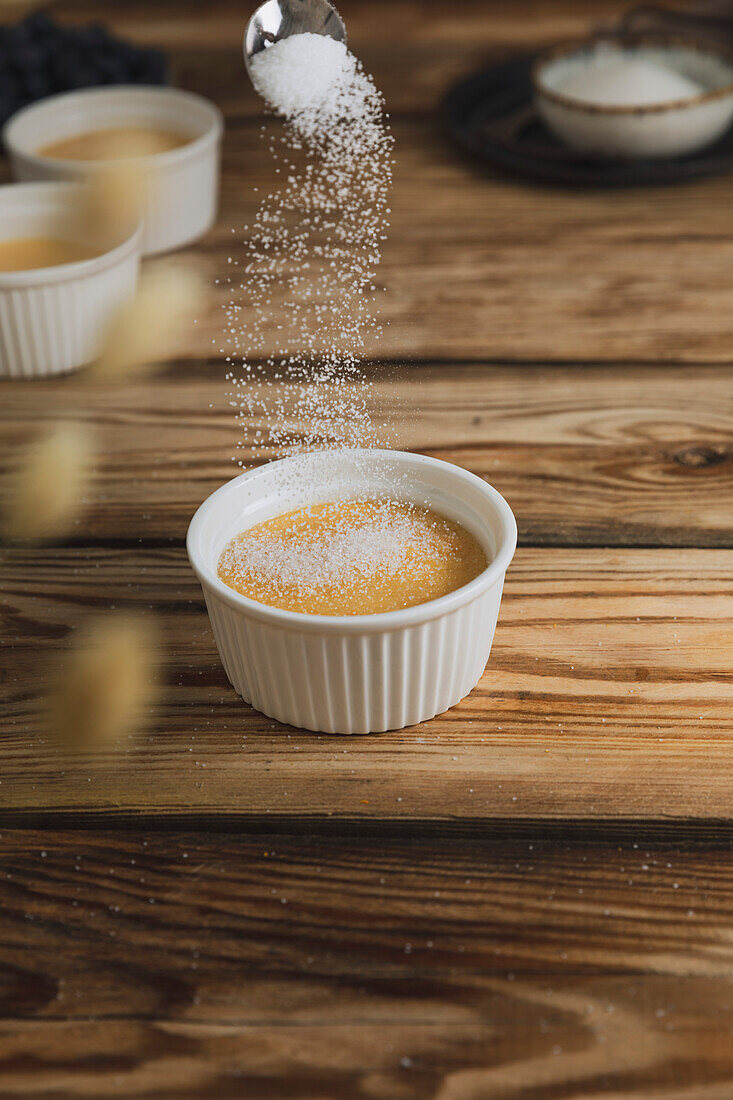 Crema Catalana Spanish custard on a wooden kitchen plate