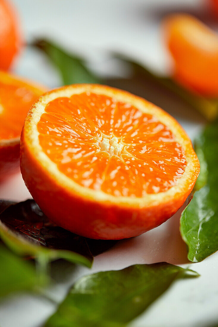 Mandarin orange slice flatlay on a marble background