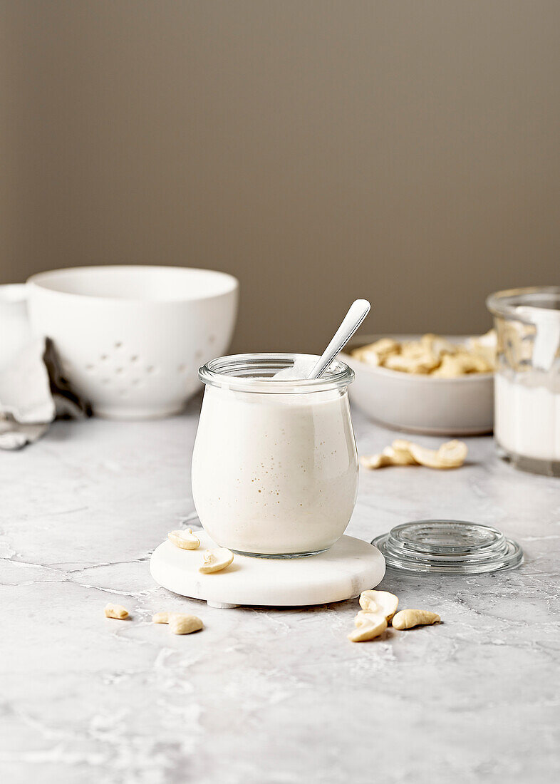 Cashew Cream with Spoon on Marble Surface