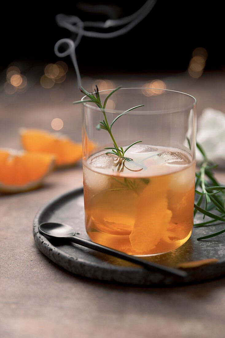 Old fashioned cocktail in a tumbler with bitters, whiskey and sugar