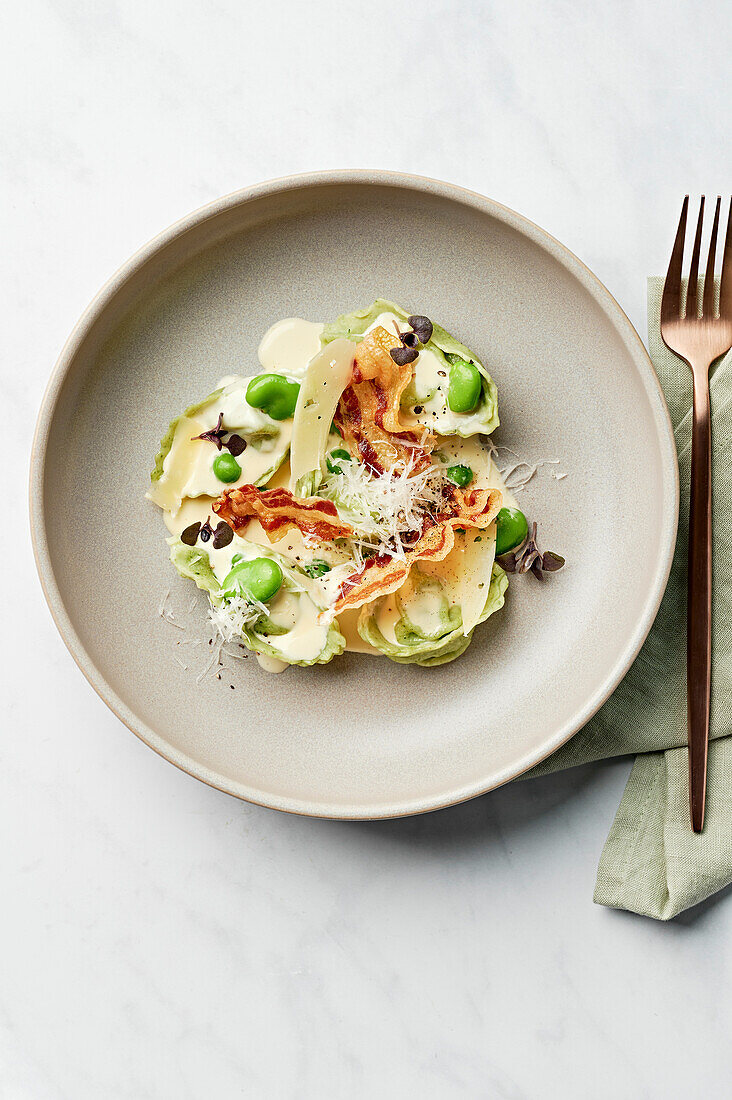 Tortelloni, cream sauce, pancetta, broad beans, pecorino, basil