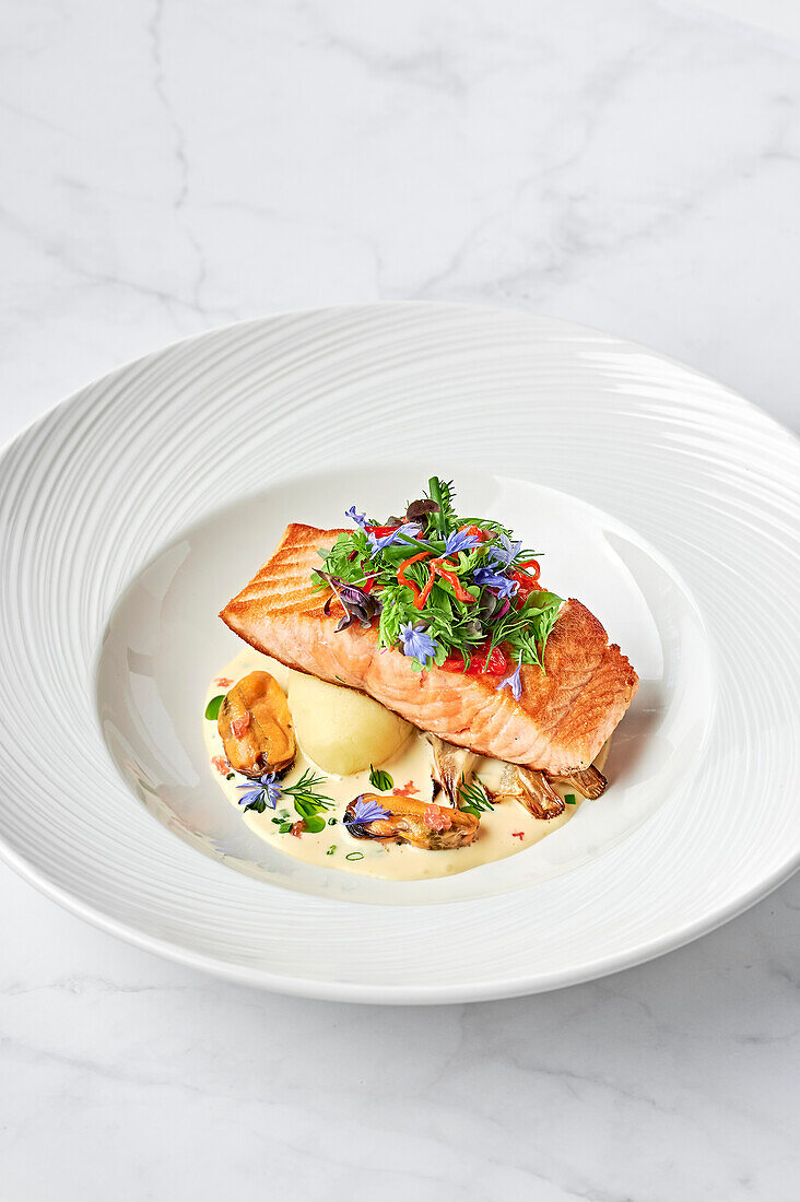 Salmon fillet, steamed mussels, beurre blanc of finger lime and chives, roasted fennel bulb, puree, red pepper and small herb salad