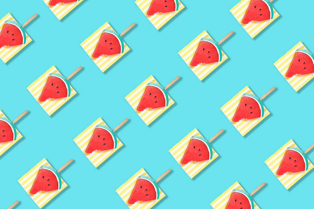 Modern retro color theme pattern of watermelon graphics against an aqua blue background.