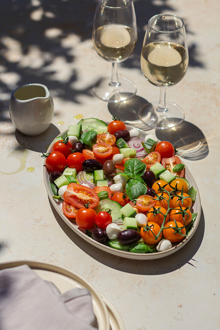 Hard light Greek salad with white wine and olive oil