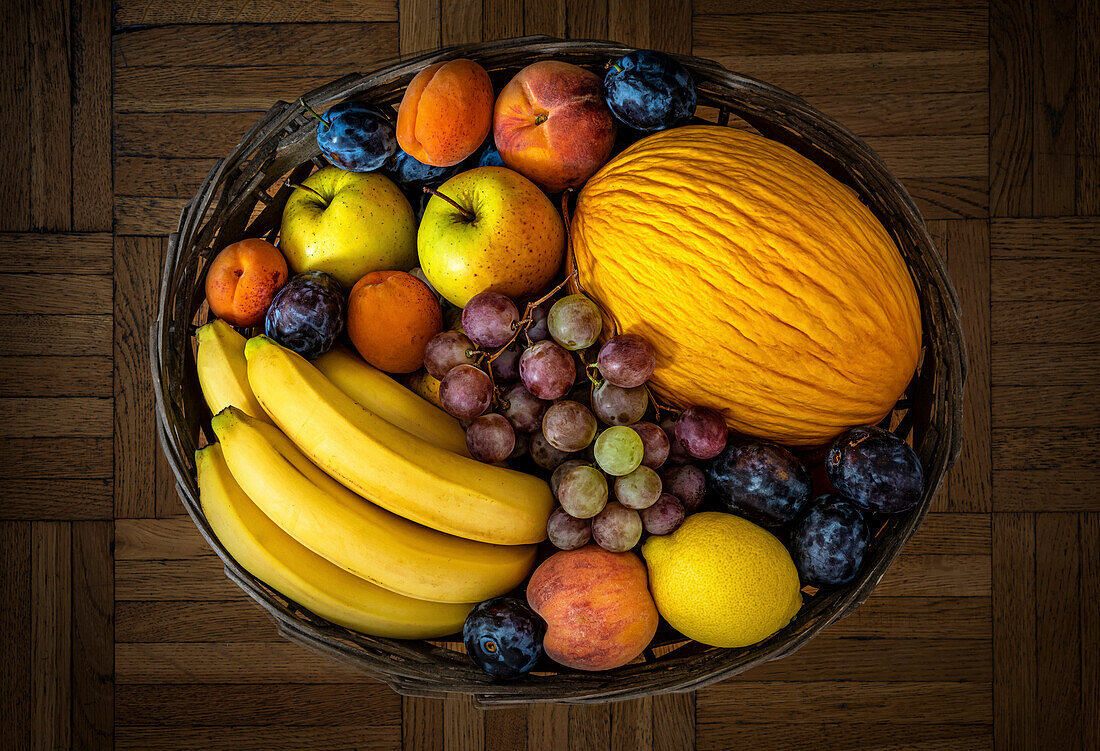 Various ripe fruits in a basket. View from above