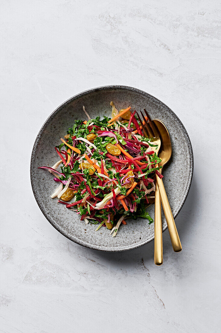 Winter salad with kale, beetroot and fennel, pickled sultanas, red cabbage and spiced pear dressing