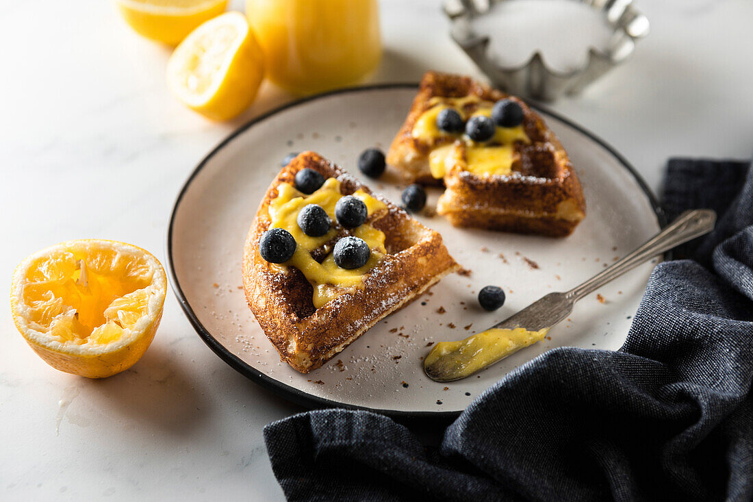 Waffles with lemon curd and blueberries