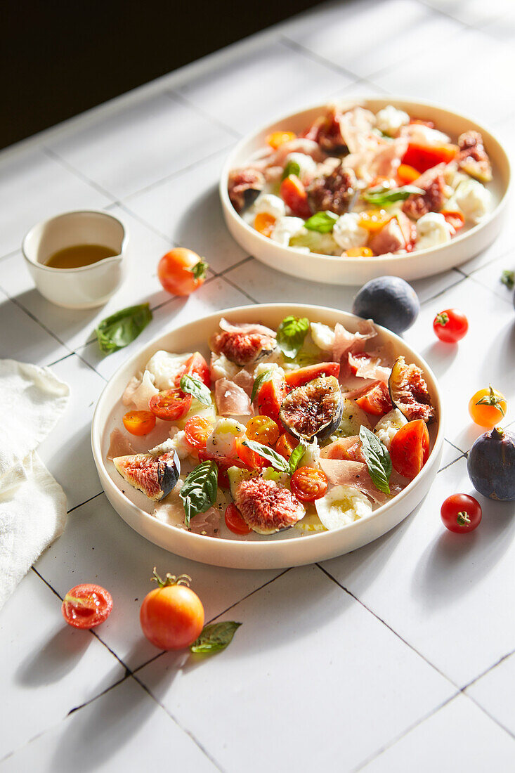 Salad of figs, proscuitto, tomatoes and mozzarella